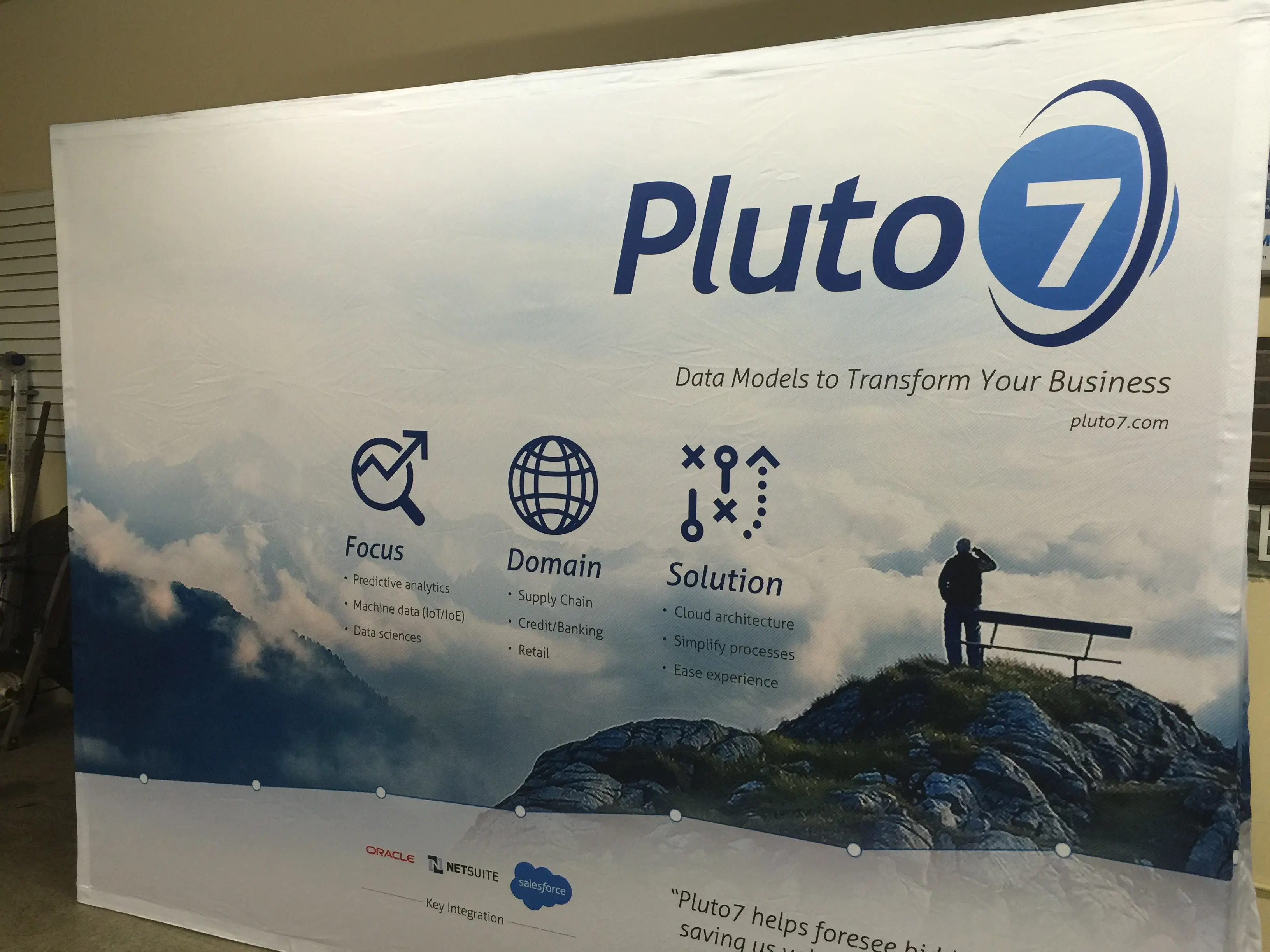 Large format trade show backwall display for Pluto7 at a Bay Area conference