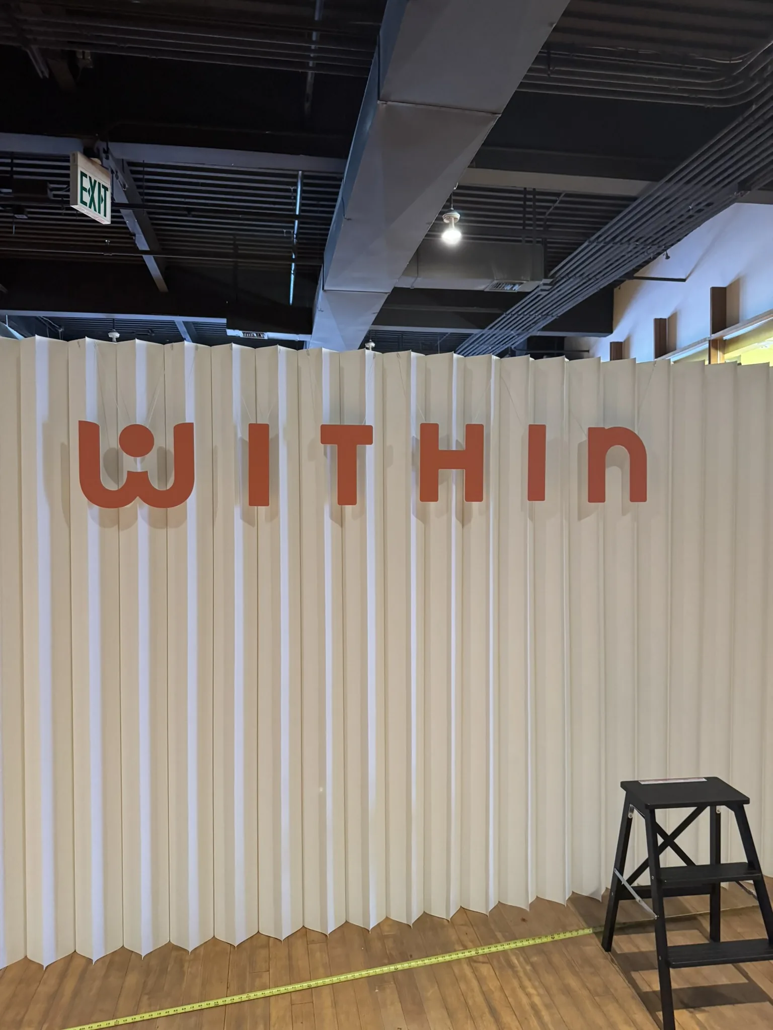 Dimensional letter accent wall on folding backdrop